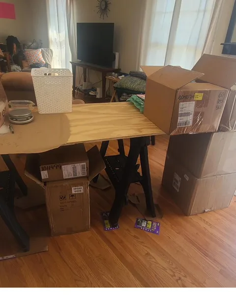The first kitting table, set up on sawhorses in the living room